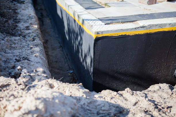 Professional Waterproofing technician working in Crane, IN